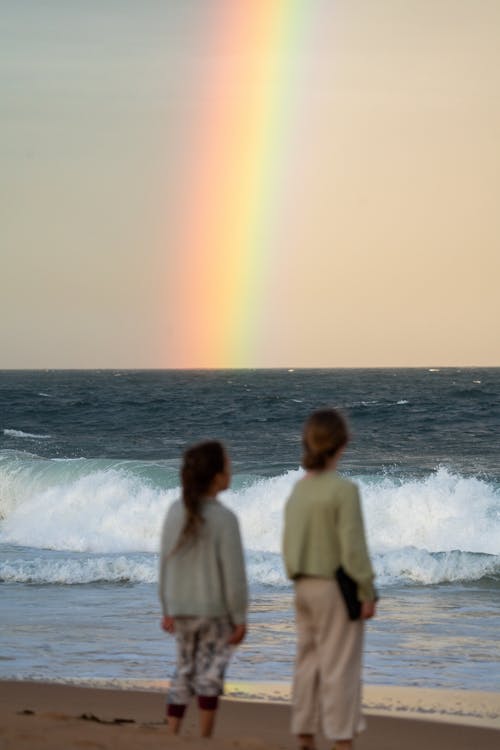 Parent watching child surf lesson